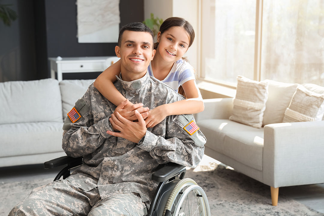 PREVIEW Girl hugging her veteran father who is in a wheelchair